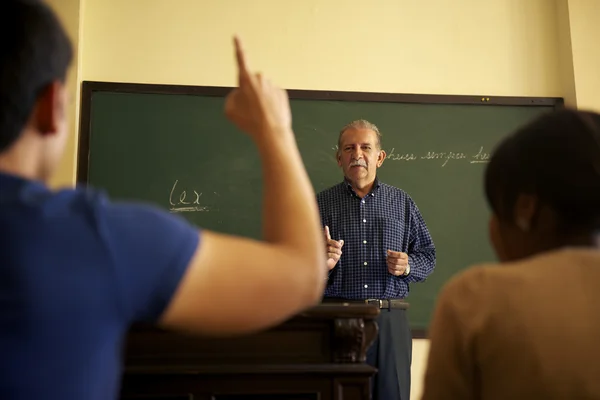 School , professor talking to students during lesson in co