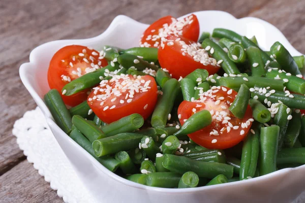 Salad of green beans, cherry tomatoes and sesame