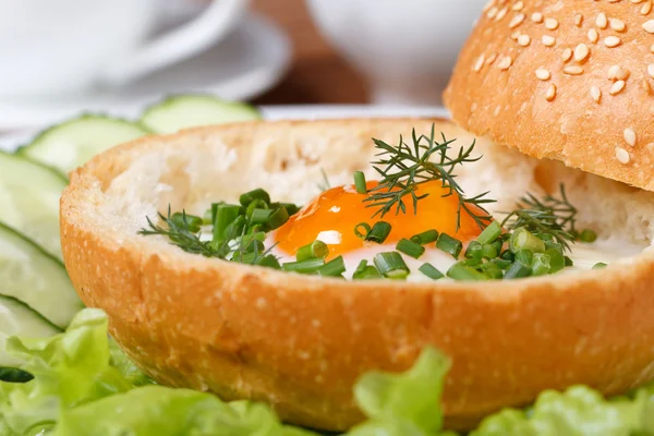 Sandwich with baked eggs with herbs and vegetables