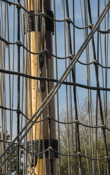 The mast of a ship with the rig