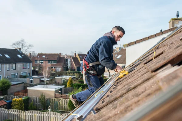 Man making the construction for the solar panels