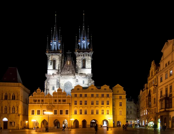 PRAGUE - February 13: Old Town Square with people, illuminated buildings and Tyn Church on background at evening. The square is very popular with tourists in Prague, Czech Republic on February 13, 201