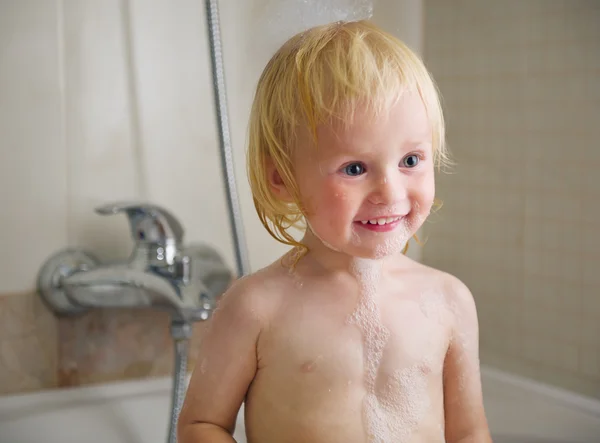 Portrait of baby in bath foam