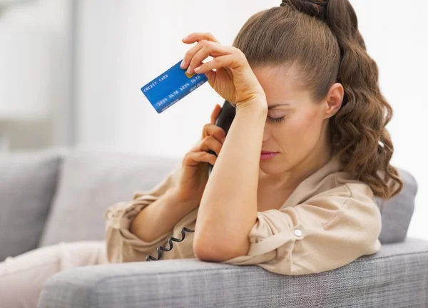 Woman with credit card and a phone