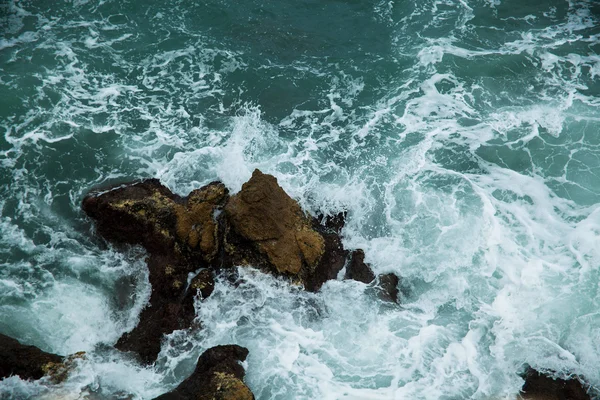 Wave breaking against cliff