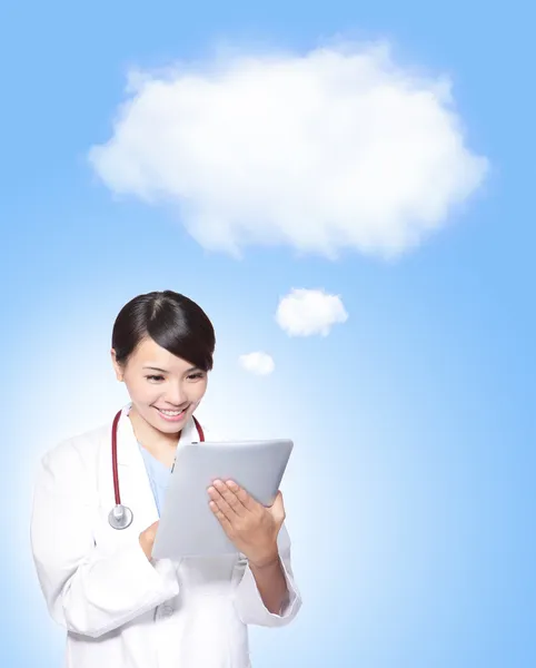Woman doctor using tablet pc