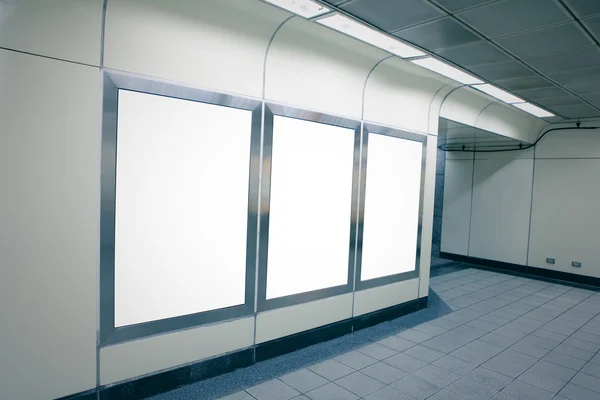 Blank billboard in metro station