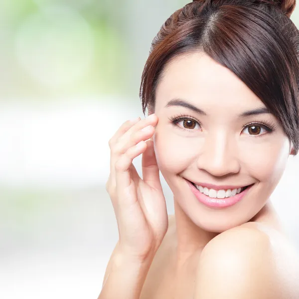 Beautiful woman smile face with clean face skin