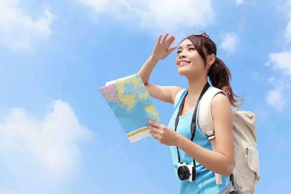 Happy travel woman looking in map