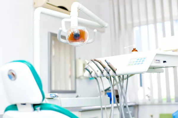 Close-up of dentist tools and equipment at dental clinic