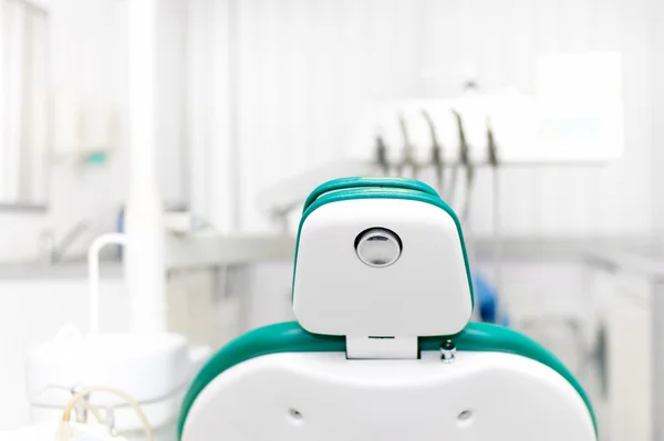 Dentist office with tools, professional dentist chair and equipment at local dental clinic