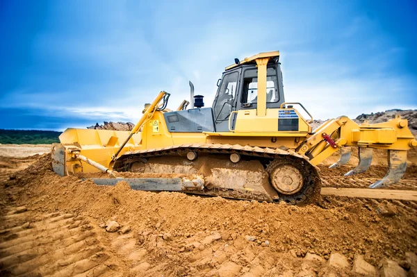 Excavator working and moving earth in construction site, highway road in construction