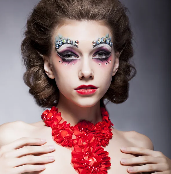 Fashion beautiful theatrical actress young bright woman in necklace - red lips