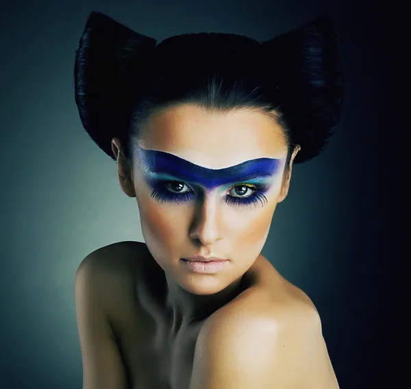 Haute Couture. Fantasy. Classy Woman with Blue Painted Mask and Modern Hairstyle