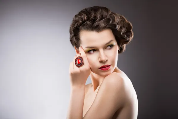 Noble Lady. Gorgeous Posh Brunette with Jewelry - Ruby Oval Ring. Braided Hairstyle