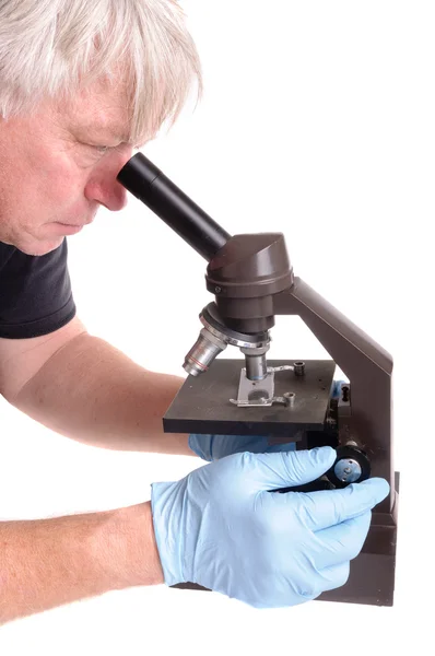 Scientist uses microscope