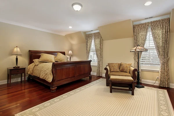 Master bedroom with cherry wood flooring