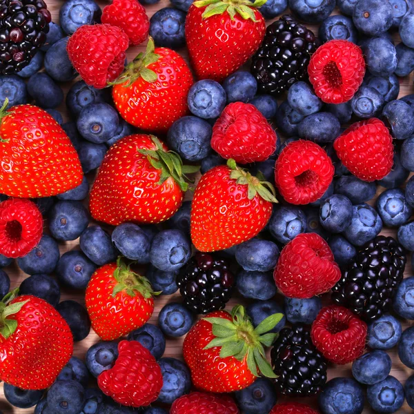 Berries Background. Strawberries, Blueberry, Raspberries, Blackberry