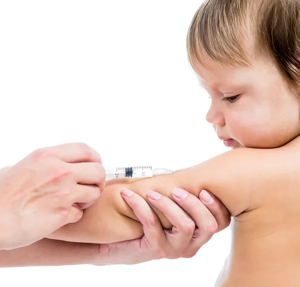 Doctor vaccinating baby isolated on a white background