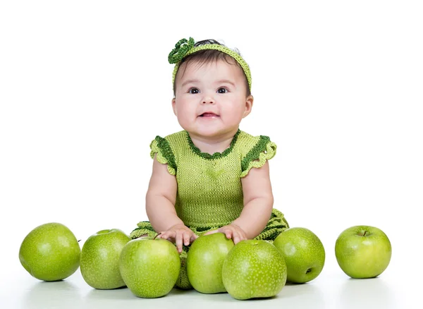 Happy baby with green apples isolated on white background
