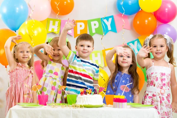 Happy children celebrating birthday holiday