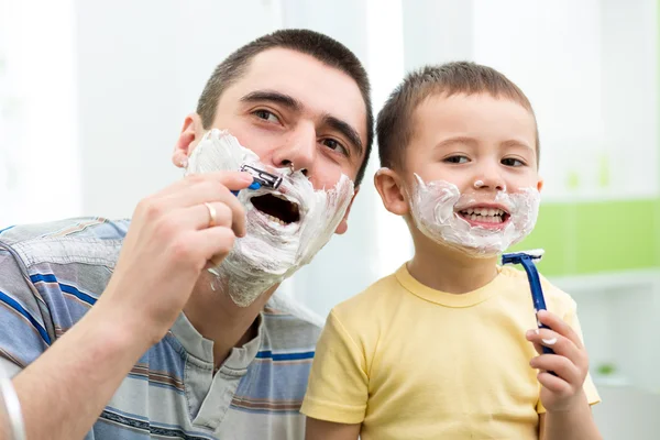 Preschooler attempting to shave like his dad