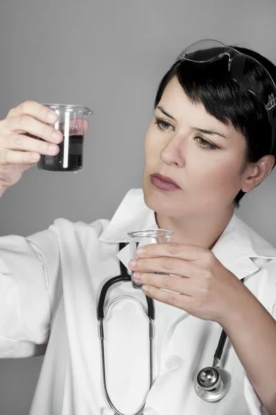 Brunette female doctor checking laboratory samples, career women