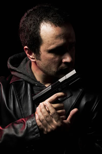 Robber with gun. Man in suit draws vintage handgun
