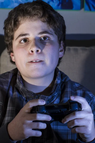 Boy with joystick playing game