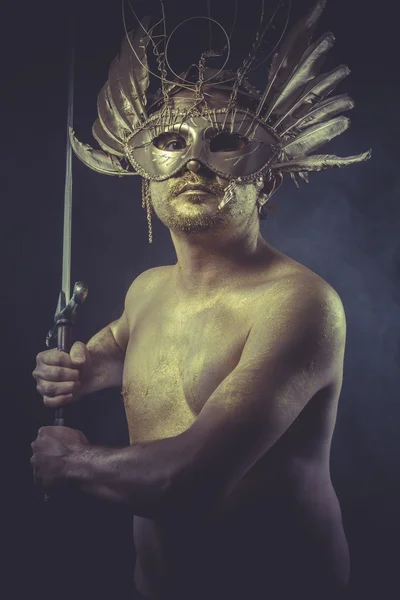 Man with wings and gold helmet