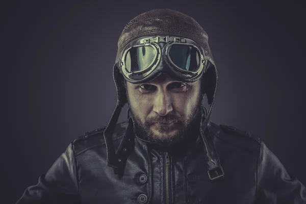 Pilot dressed in vintage style leather cap