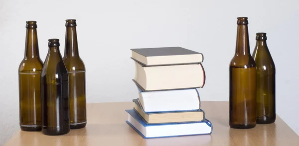 Books and beer bottles on the table