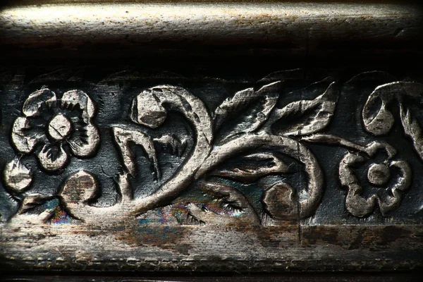 Floral designs, engraving on copper, floral ornament on metal texture