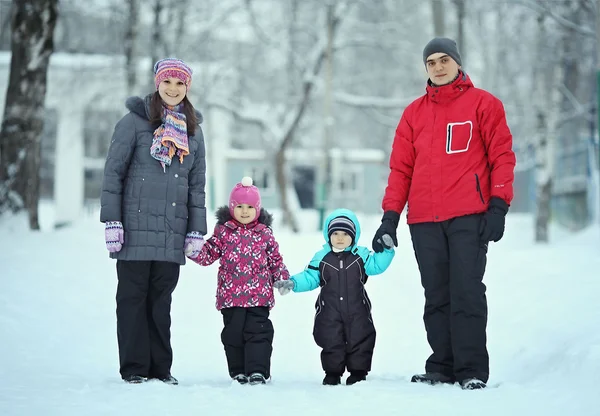 Complete family with children walking in winter