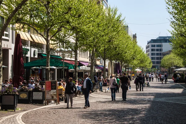 People walk on a pedestrian zone in Frankfurt