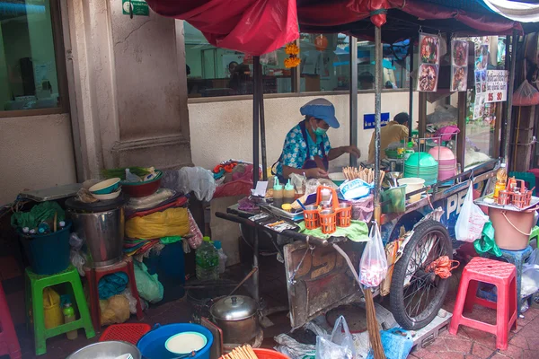 A street vendor sells soups