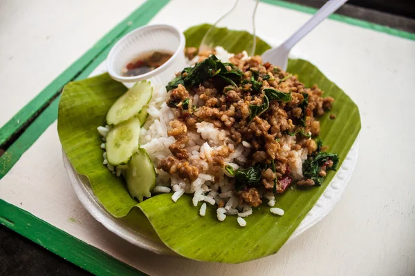 Thai rice meal on banana leaf