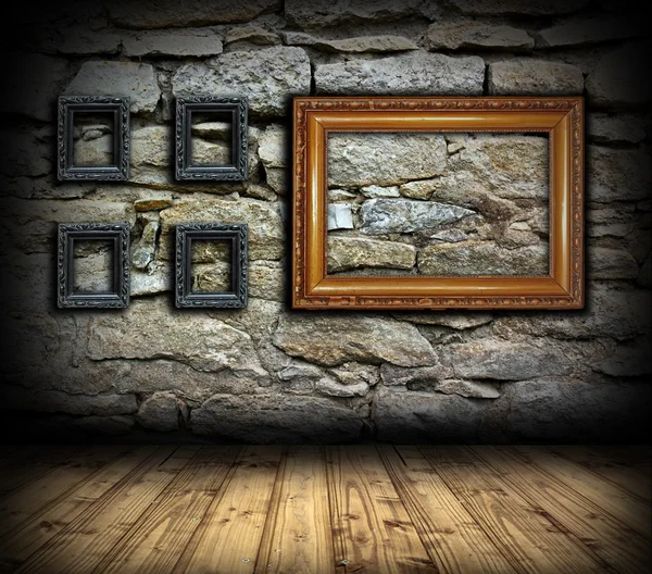 Stone wall with wood painting frames