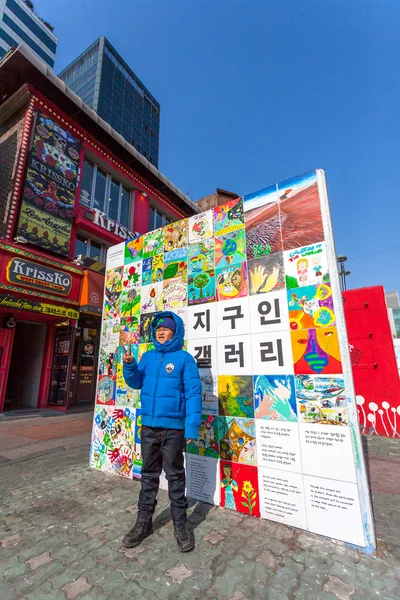 SEOUL - MARCH 8: Tourist action photography with art  at Hongdae