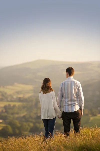 Young couple in beautiful landscape