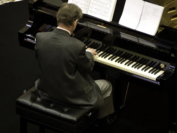 Senior man playing the piano