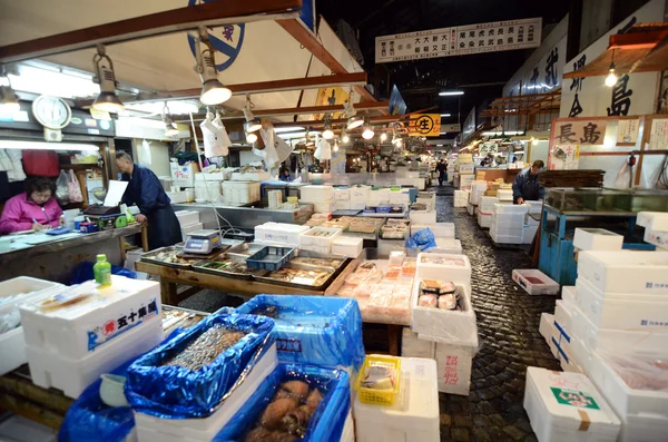 TOKYO - NOV 26: Seafood vendors at the Tsukiji Wholesale Seafood and Fish Market in Tokyo Japan