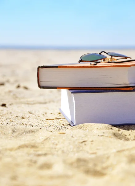 Vacation Beach with Books in Sand