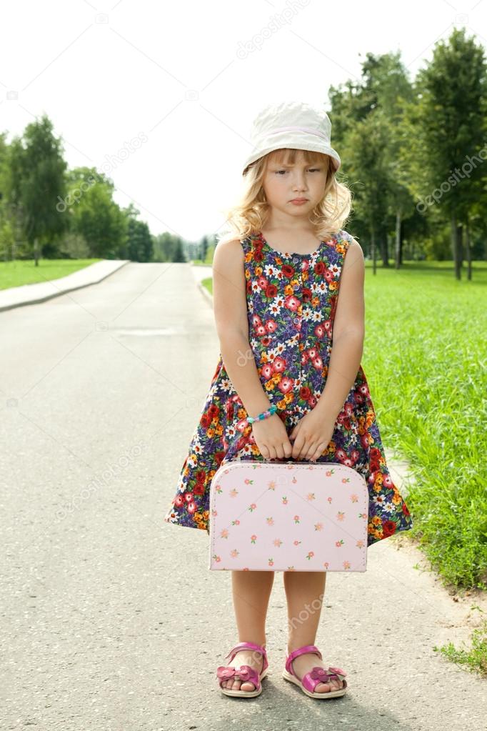 Girl standing alone on the roadside ??? Stock Photo ?? Aksakal 12382412