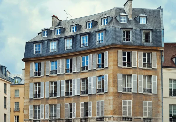 View of Unique traditional French windows and balconies. Paris,