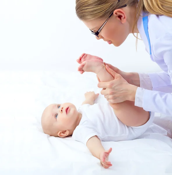 Woman doctor with tiny baby