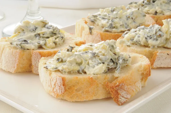 Spinach artichoke dip on Italian toast