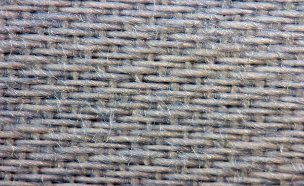 Grey background from a fabric. Macro