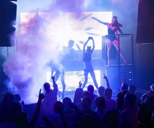 Silhouettes dancing at nightclub