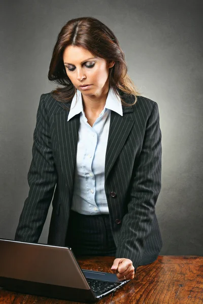 Attractive manager woman angry with the computer
